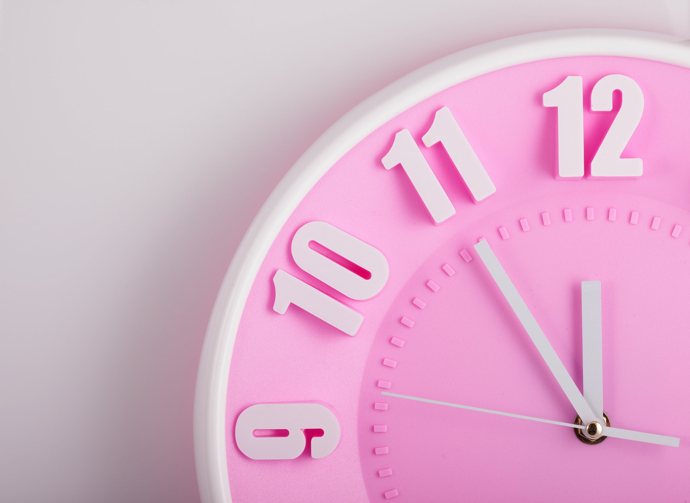 pink clock face closeup